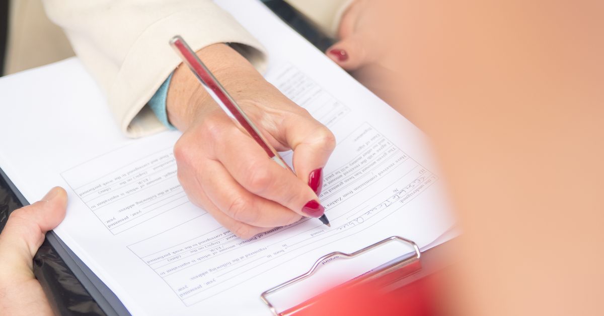 Woman Hand Writing Document · Free Stock Photo