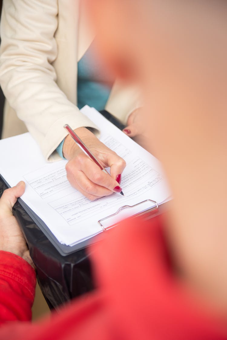 Woman Hand Writing Document