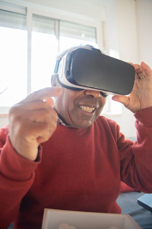 Elderly Man using Virtual Reality Goggles 