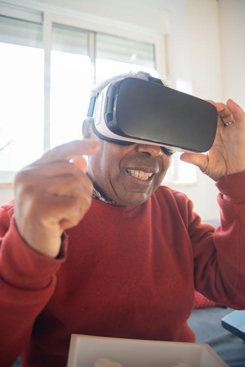 Free Elderly Man using Virtual Reality Goggles  Stock Photo
