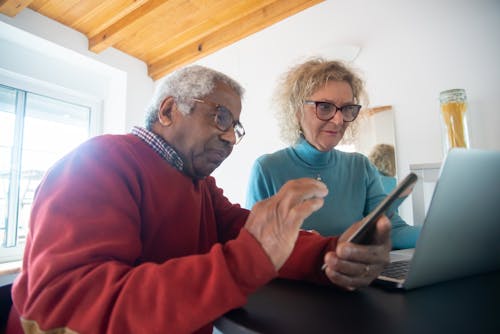 Free An Elderly Couple Shopping Online Stock Photo