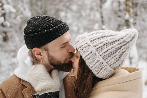 Free Photograph of a Man Kissing a Woman on the Nose Stock Photo