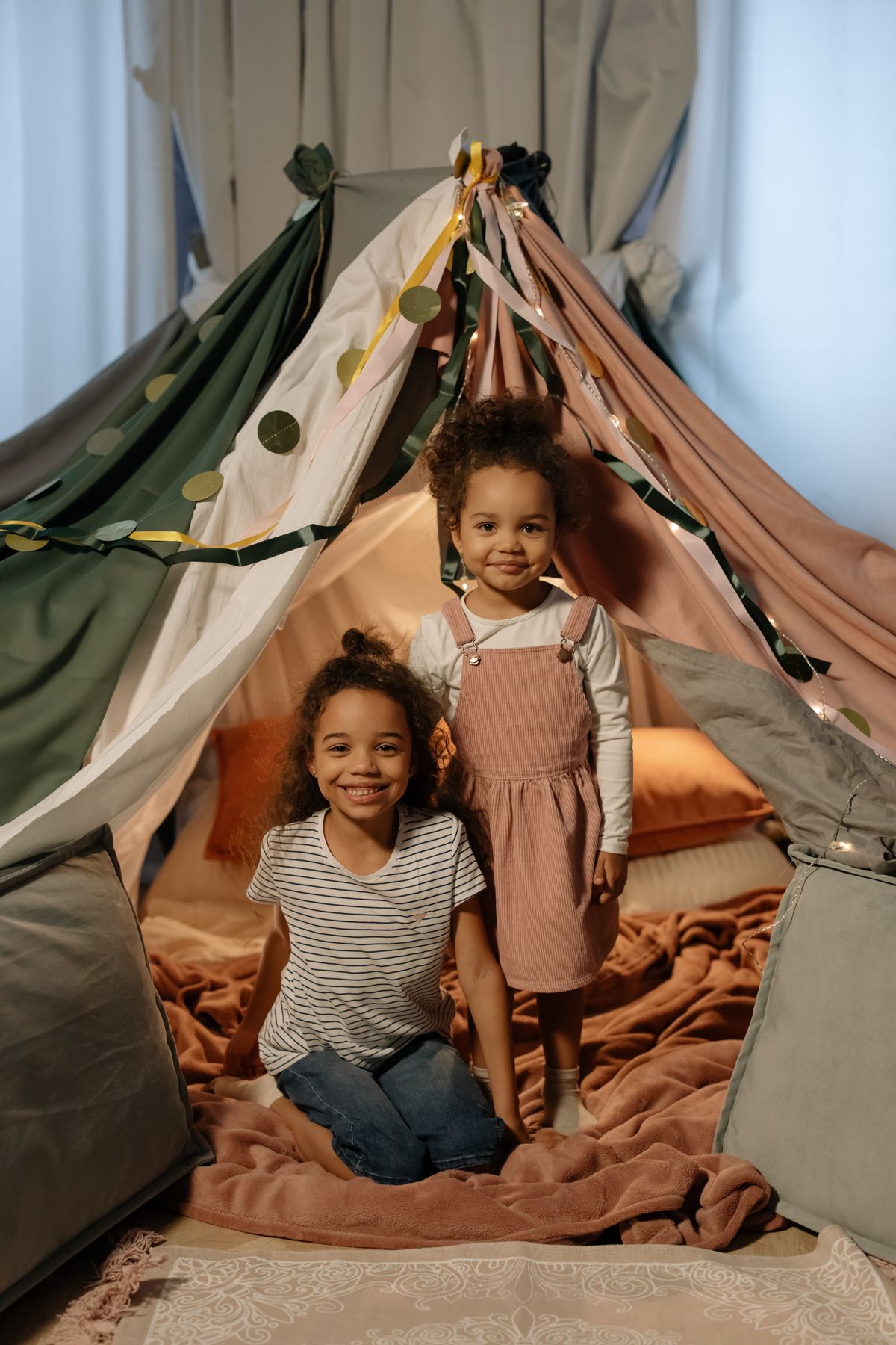 Cozy blanket fort playtime indoors during rainy day games for kids