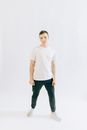 Man in White Crew Neck T-shirt and Black Denim Jeans