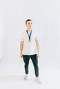 Man in White Polo Shirt and Black Pants