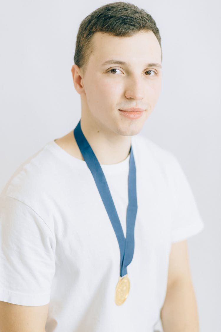 Young Man Wearing A Gold Medal