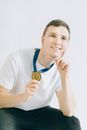 Man in White Crew Neck T-shirt Wearing Blue and White Lanyard
