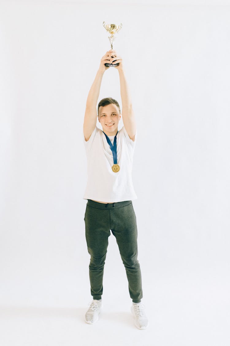 Man Holding A Trophy