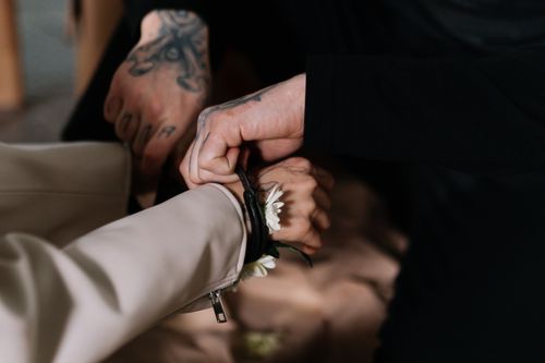 Free Hands bound by flowers and rope, symbolizing peaceful protest and activism. Stock Photo