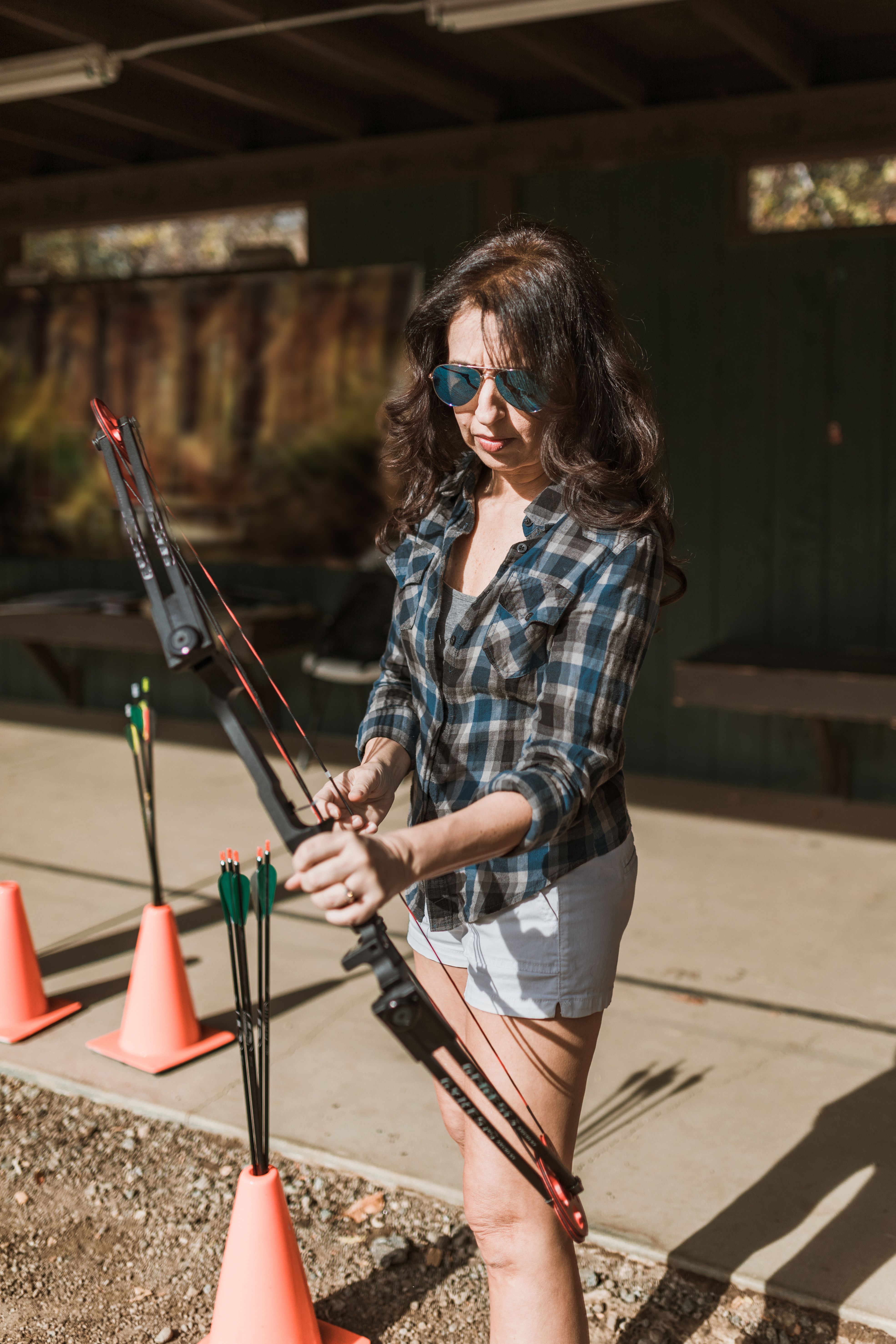 Woman Holding a Bow and Arrow · Free Stock Photo