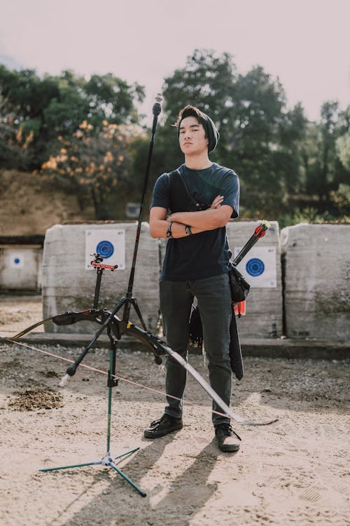 Free Young Man Practicing Archery Stock Photo