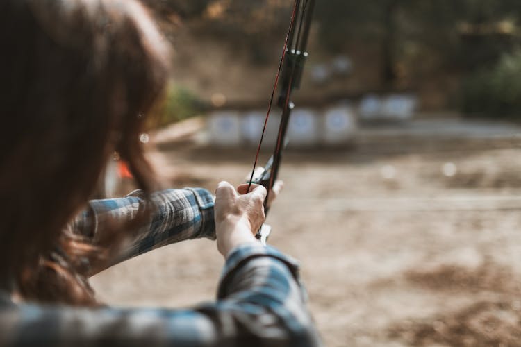 Woman Holding A Bow And Arrow