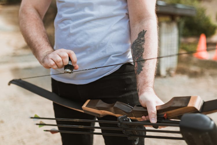 Person Waxing A Bow