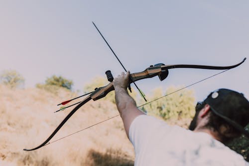 Free Person Holding a Recurve Bow  Stock Photo