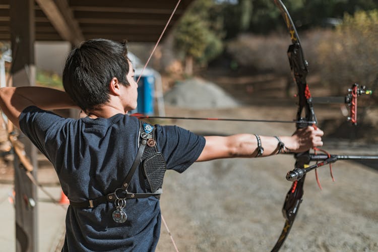 Man Aiming Bow And Arrow 