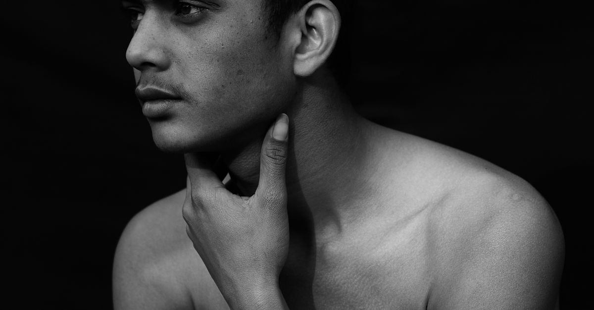 Neck Less Man Shirtless Man Posing with Hand on Neck · Free Stock Photo