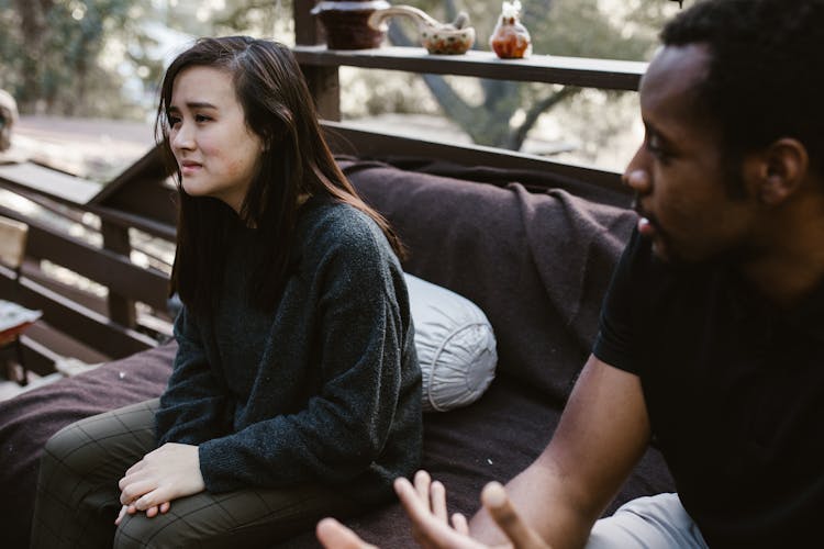 Man Sitting Beside The Crying Woman 