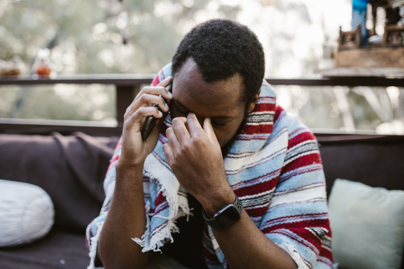 Hands folded in quiet prayer over an open Bible