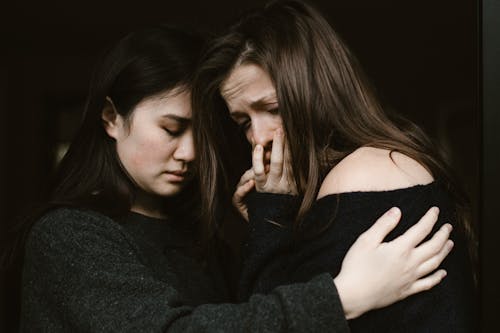 Woman Giving Comfort to an Emotional Woman