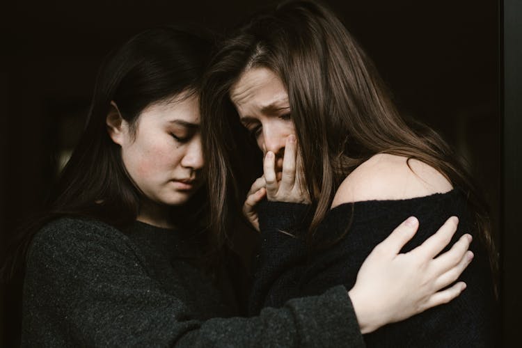 Woman Giving Comfort To An Emotional Woman