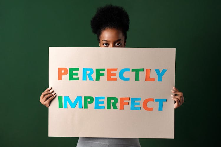 A Woman Holding A Poster