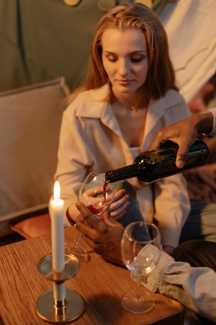 Person Pouring Wine