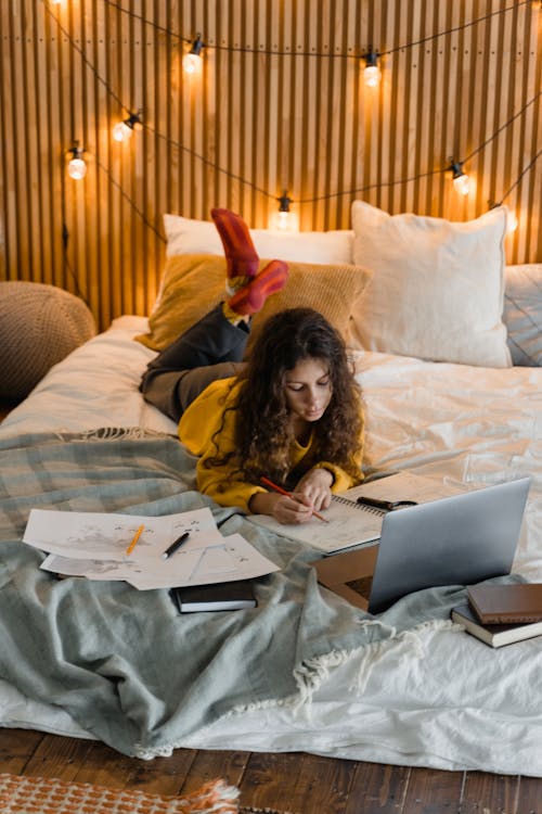 Woman Writing on a Notebook