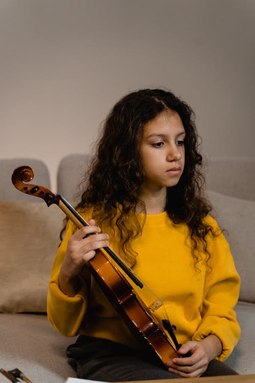 Free Girl Holding a Violin Stock Photo