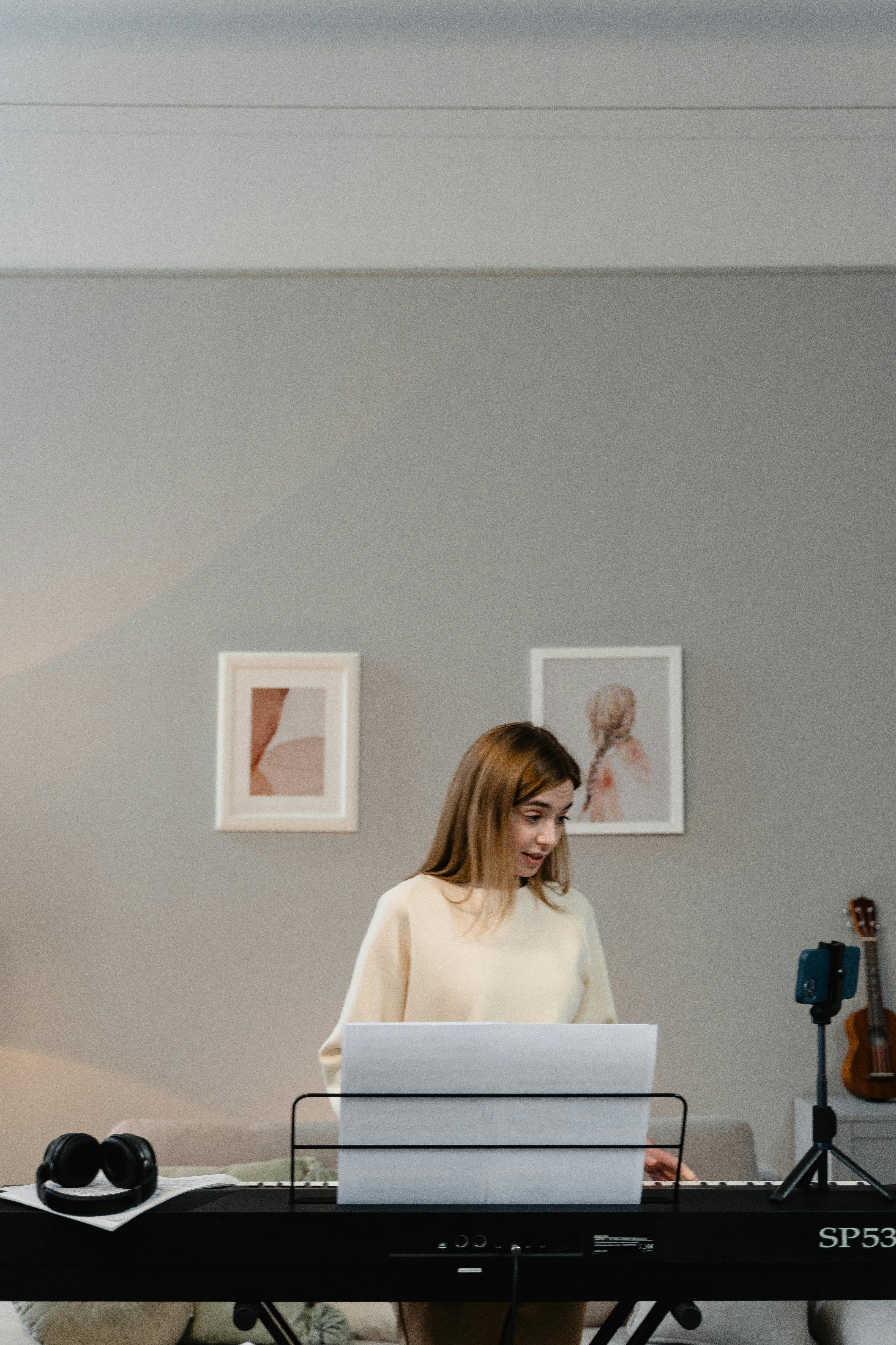 A Woman Teaching A Piano Lessons (View More By Boris Pavlikovsky