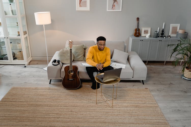 Man Sitting On A Couch