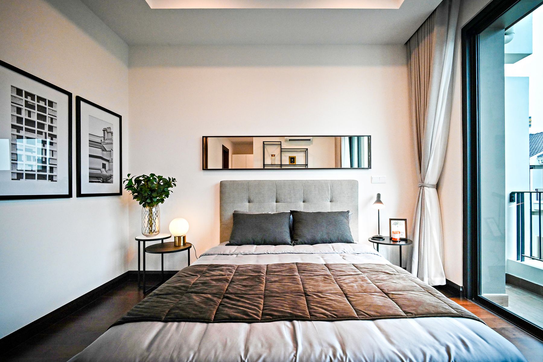 Framed wall art positioned in relation to furniture below
