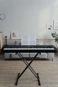Stylish living room featuring a digital piano with sheet music in a minimalistic setting.