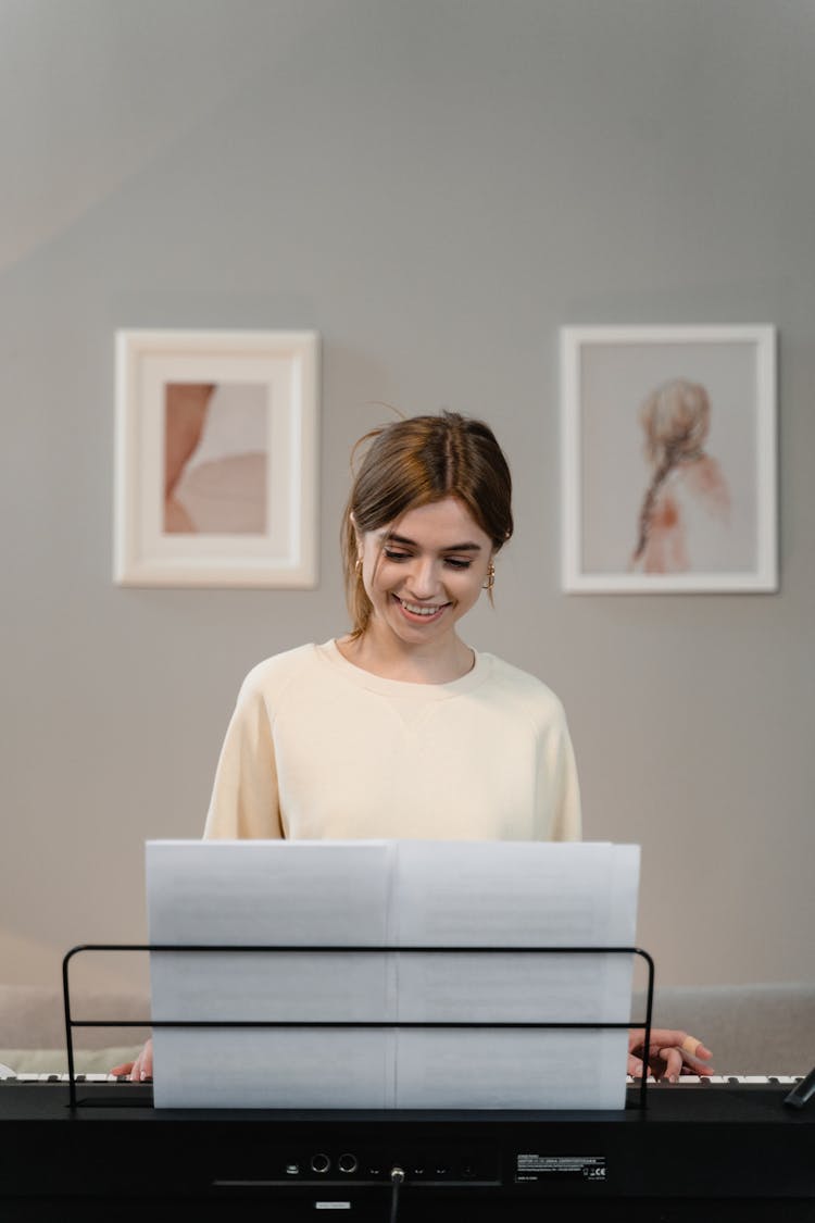 A Woman Playing The Keyboard 