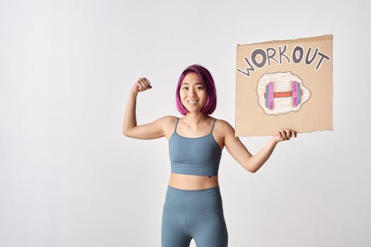 Woman in gym attire holding a cardboard sign with 'WORKOUT' and dumbbell drawing.