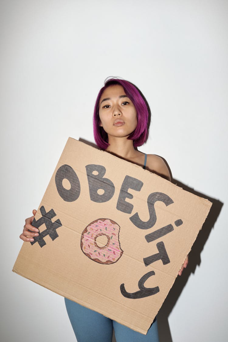 Obesity Written On A Cardboard 