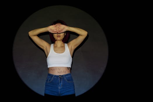 Fashion photography of a young woman in a studio spotlight, emphasizing healthy habits with a modern style.