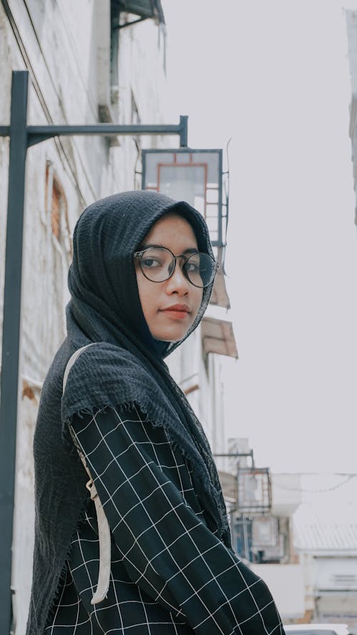 A Woman in Black Hijab Wearing Eyeglasses