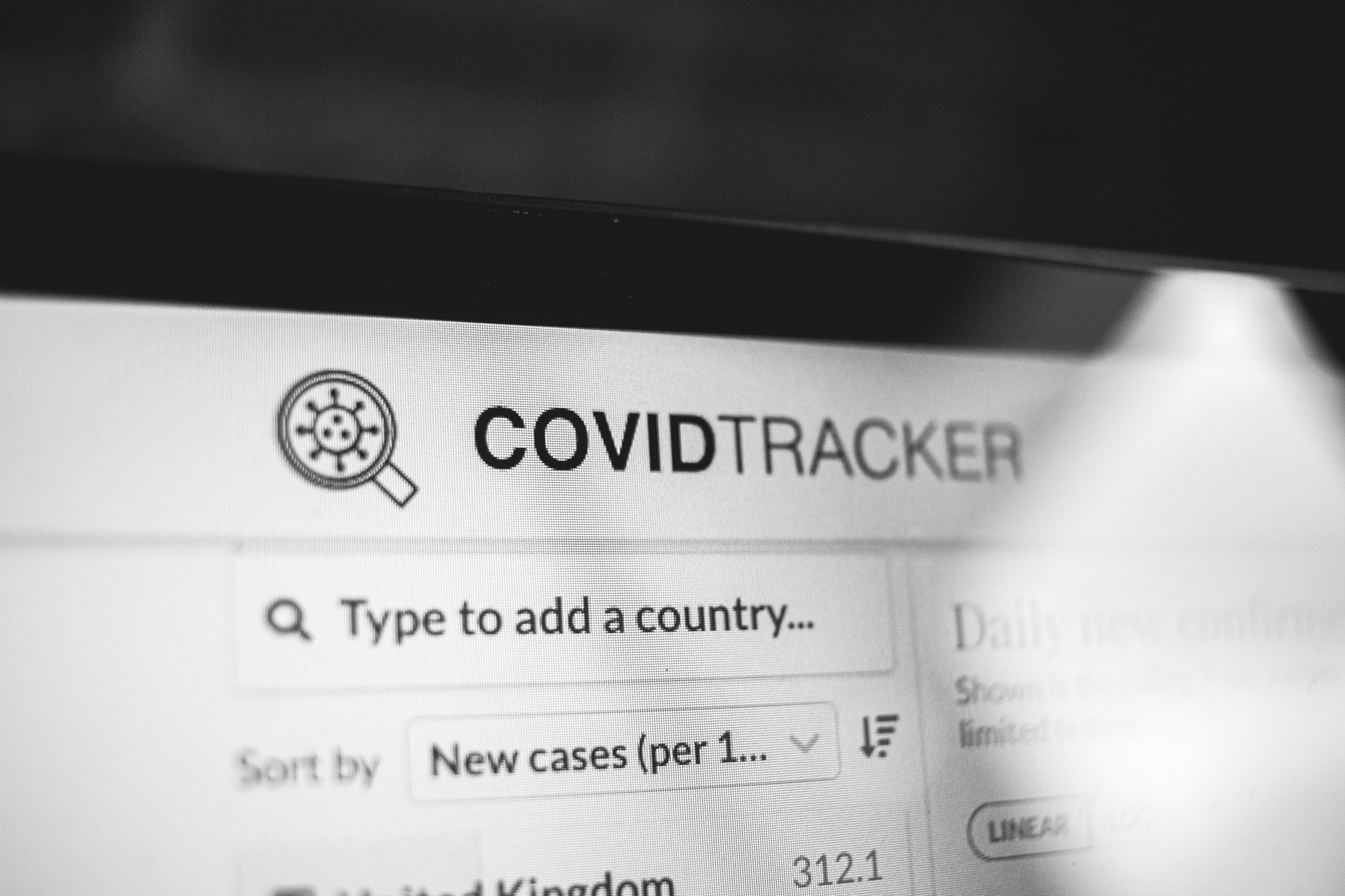 COVID Tracker title on website of laptop screen