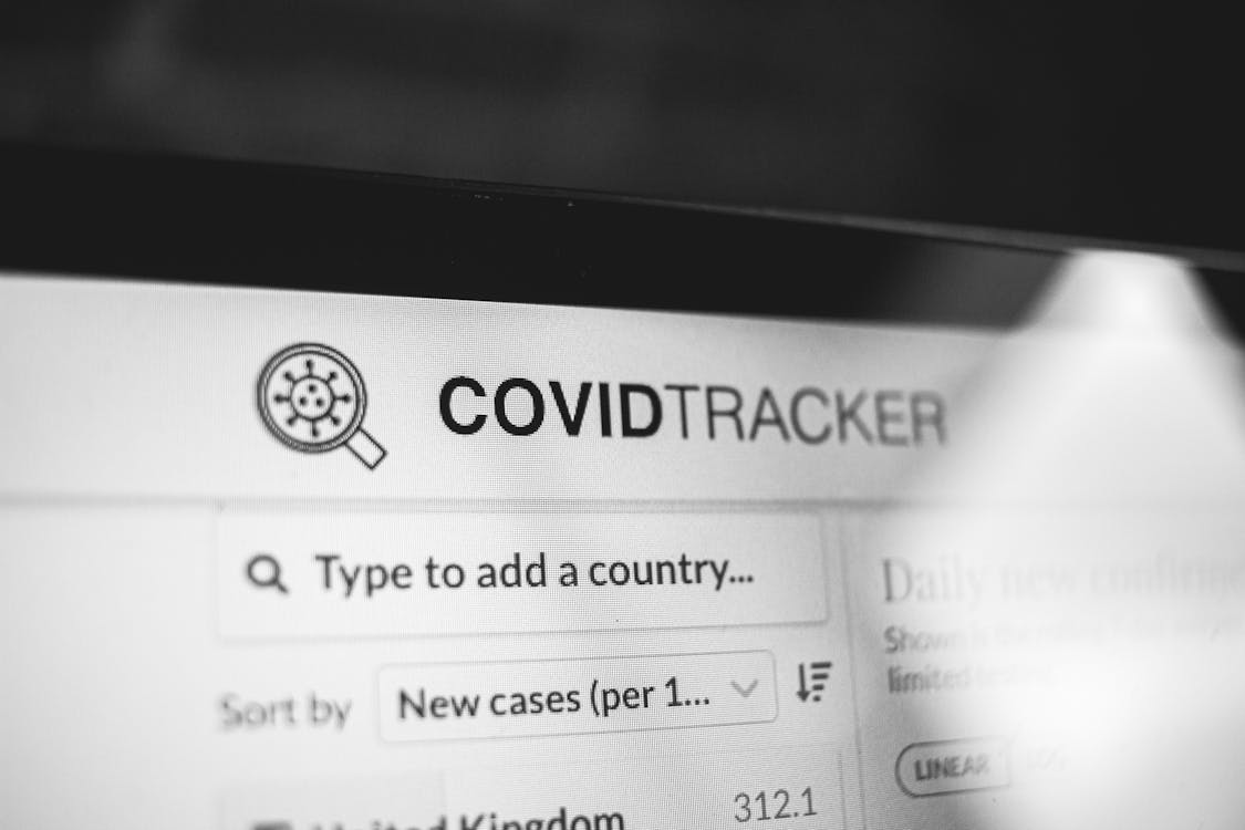 Free COVID Tracker title on website of laptop screen Stock Photo