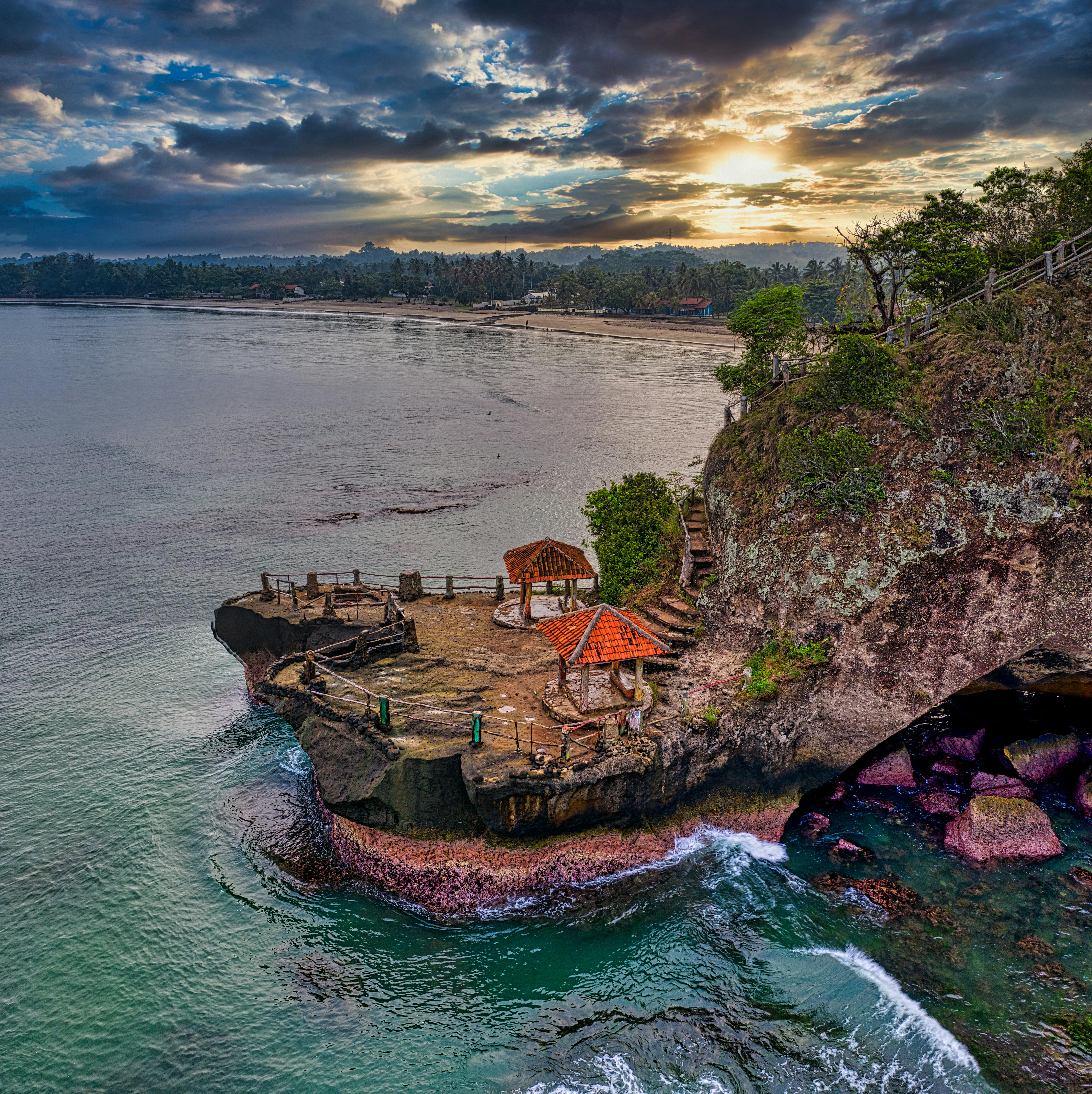 Cliffside yoga platform overlooking the ocean at sunset on the Bukit Peninsula in Uluwatu, Bali
