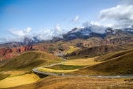 Green Valley and Mountains in Fog