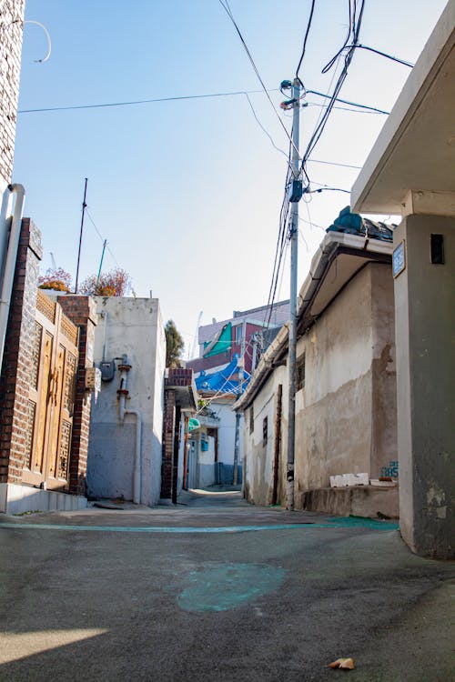 Narrow Concrete Alleyway Between Houses