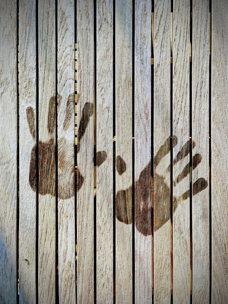 A Hand Prints On Wooden Wall Photo