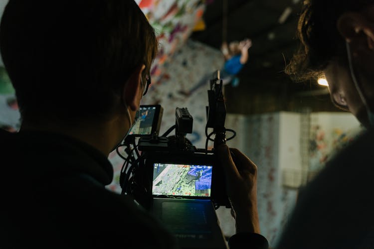 
A Person Reviewing A Footage In A Camera