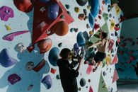 A Man Climbing a Wall