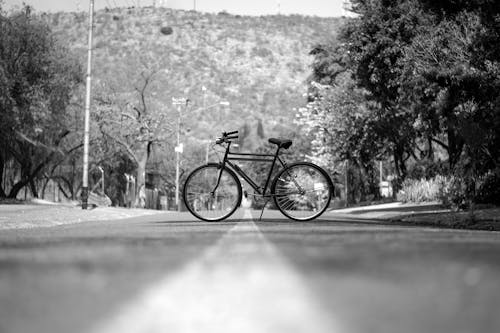 Free Grayscale Photo of Bicycle on the Road Stock Photo