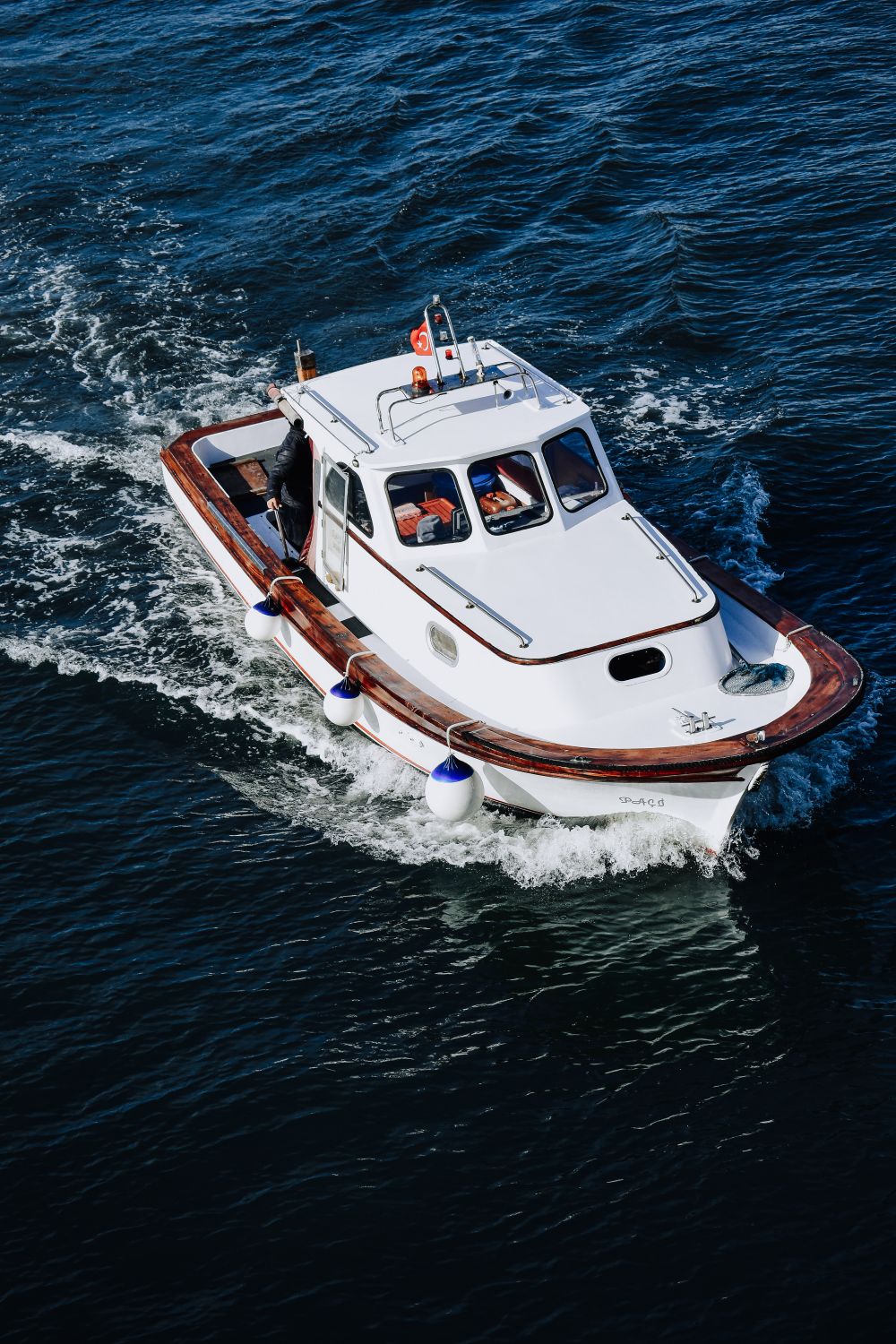 Limousine tender running on clear blue water