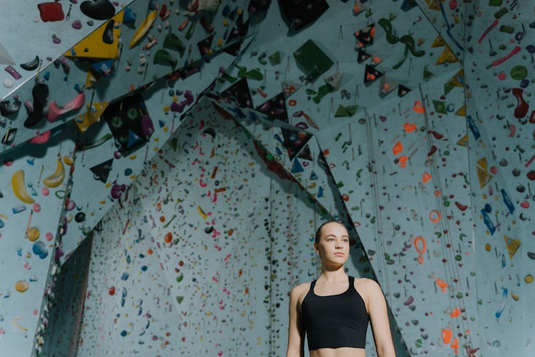 A Woman Wall Climber In Black Top