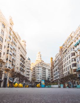 Low-angle shot of urban architecture in Valencia, Spain showcasing white concrete buildings.