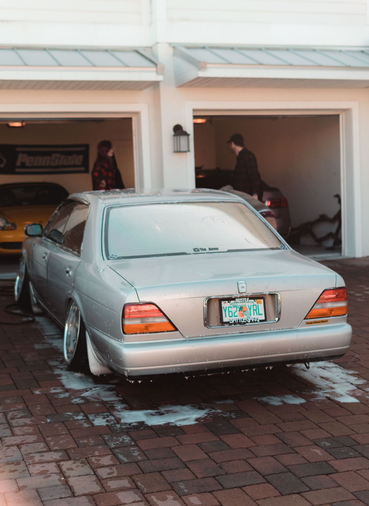 Clean car on a freshly washed driveway